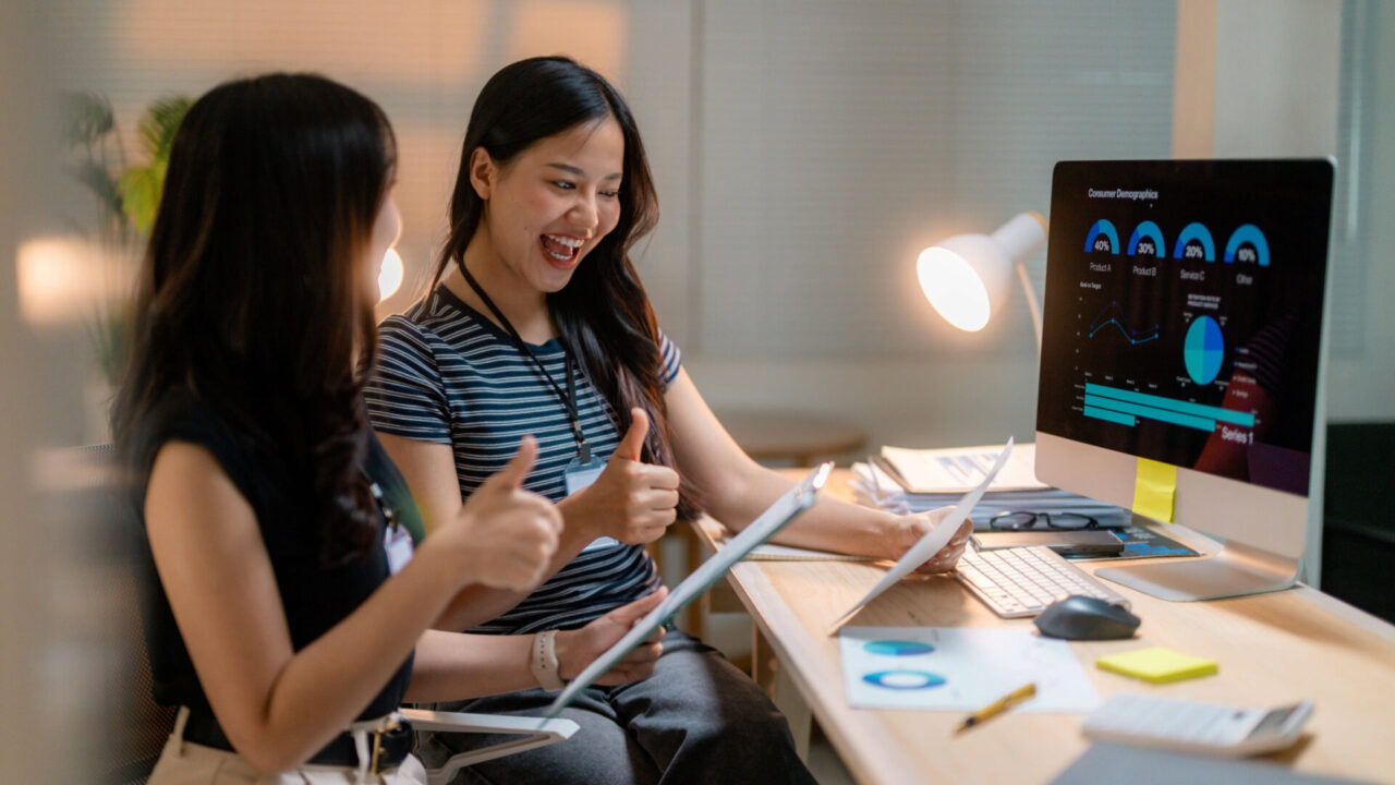 asian businesswomen showing thumbs up looking at i 2025 03 30 18 17 49 utc 1920x1080 1