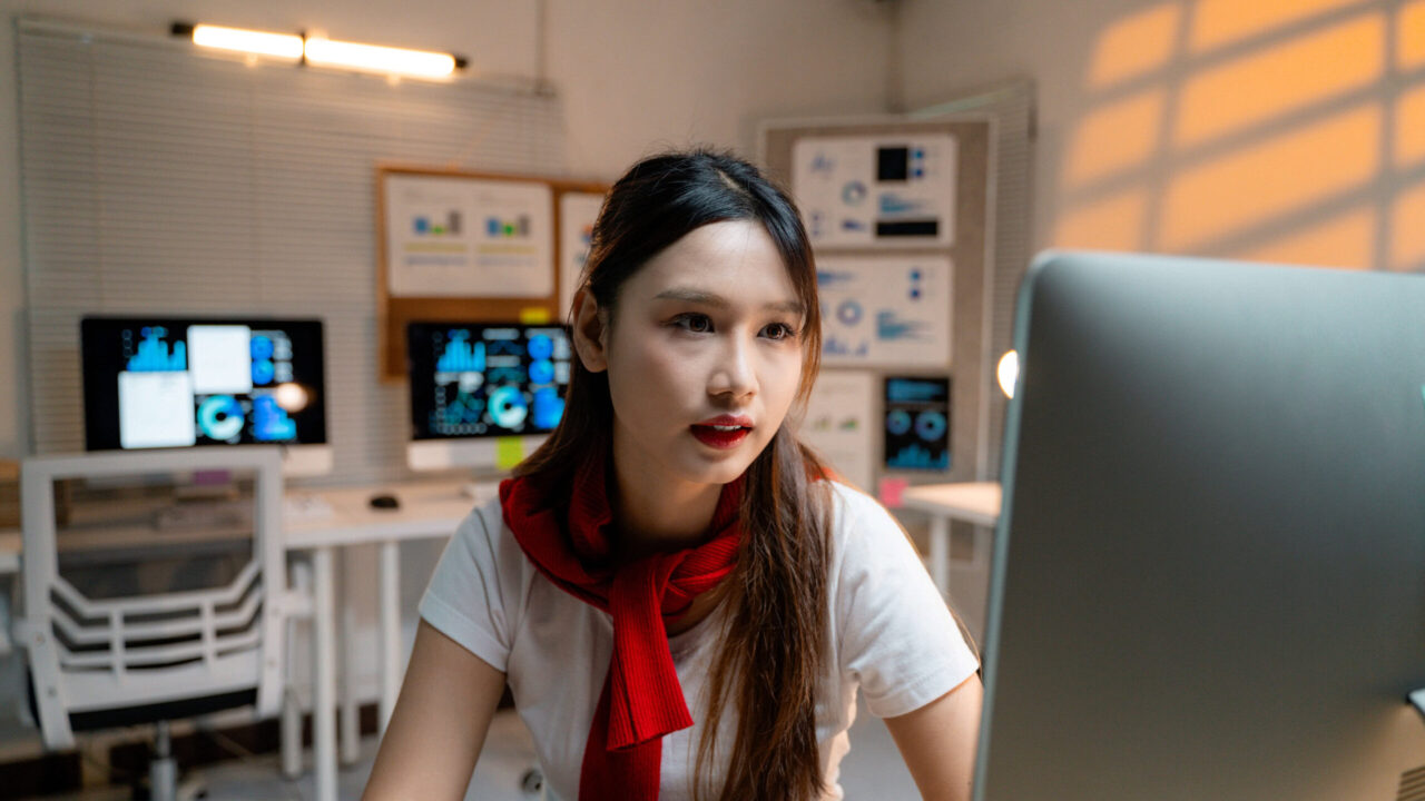 young asian businesswoman analyzing data on comput 2025 03 18 21 16 26 utc scaled 1 1